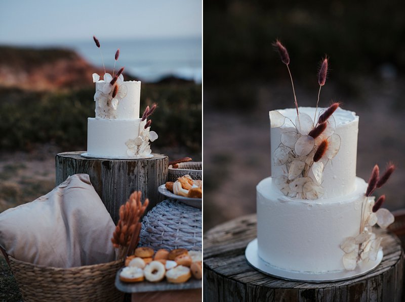 beachside clifftop wedding feast, wedding sunset picnic, sunset wedding, boho styled wedding feast, dried flowers wedding cake